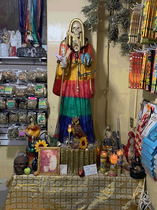 syncretic folk figure central america offerings tobacco alcohol Santa Muerte Devotion