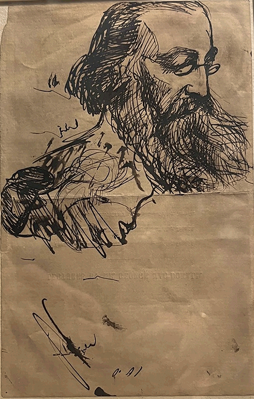 the back side of a programme with a detailed doodle of George MacDonald with a large beard and wearing spectacles. Facing another direction there is a series of women’s faces in profile. Most are scribbled over.