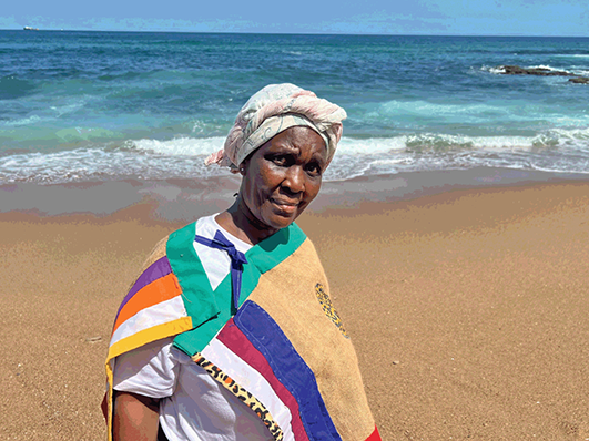 Maphitini’s daughter photographed in 2024 standing at the spot on the sea where her father used to meditate and her sister disappeared into the sea.
