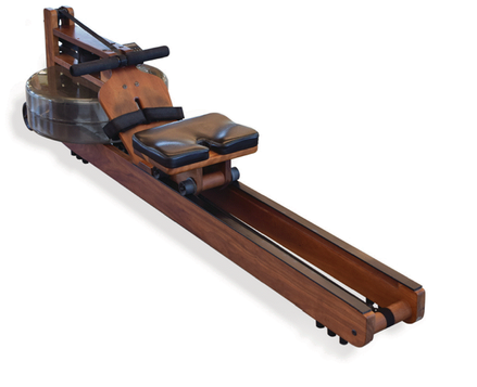 A photo of a water rowing machine. It has a wooden or wood-like frame, a seat with padded cushions, and a handle for pulling.