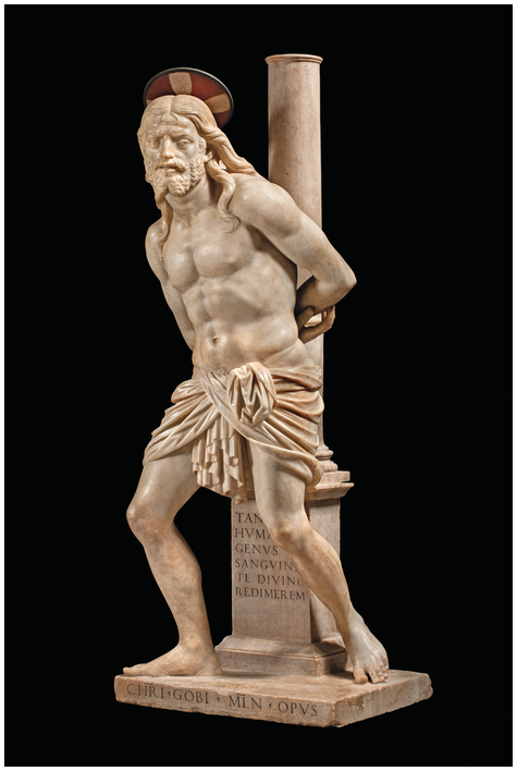 A white marble sculpture of Christ, nude other than a loincloth, revealing an idealized physique. The figure folds his arms behind him, bound to a long column. The sculptor's signature appears in Latin lettering at the base.