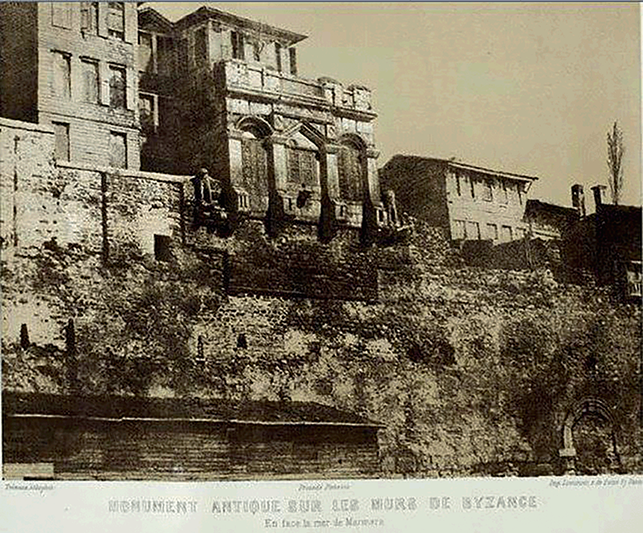 A photograph depicting the Balcony of the Lions in 1850, before it was demolished twenty years later. Notable features include the two lions flanking the balcony, with windows and false doors intricately carved in marble.