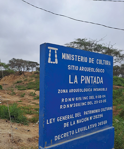 A Blue sign from Peru’s Ministry of Culture marking the location of Huaca Pintada.