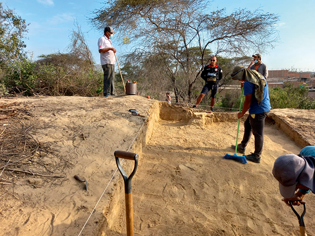 Excavations atop the huaca observed by Don Augusto and Ronald Granados.