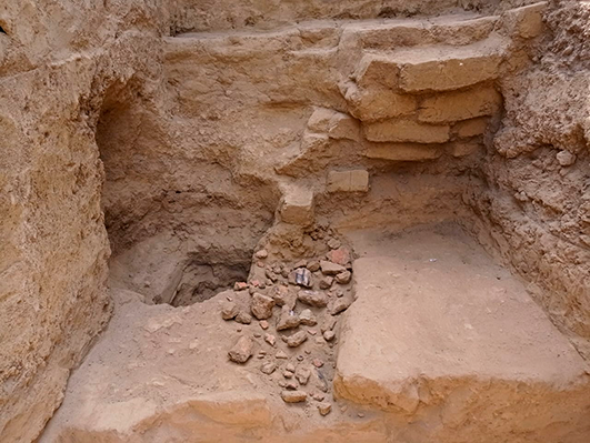 Painted wall fragments likely damaged during pre-Hispanic times.