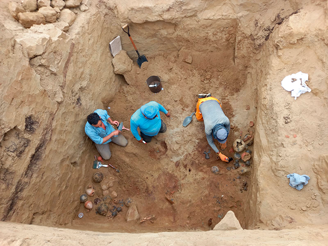 Nayo and Don Damian excavating an Inca burial chamber at the site.