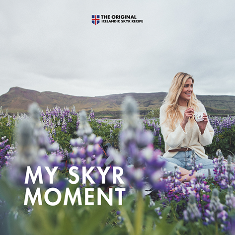 MS Dairy skyr commercial showing a young woman sitting outside in nature eating skyr.