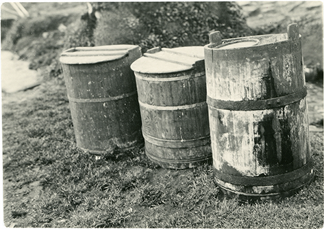 Three wooden skyr barrels placed outside.
