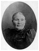 Potraint of Anne Strand, taken in the late 1800s. Seated in a posed studio photograph, wearing formal 19th-century clothing and looking directly at the camera.