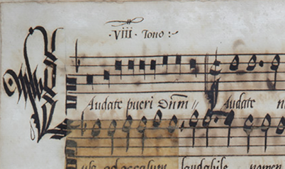 A small section of a 16th-century music manuscript. The first bar of music is written in black chant notation. The music continues in white notation, which is also visible on the second system. See long description.