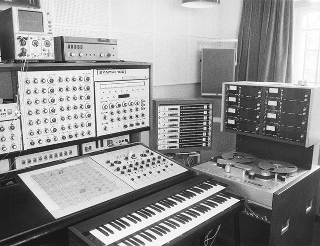 EMS Radio Belgrade’s Synthi 100 and other equipment, including two piano keyboards, large speakers, a large reel-to-reel machine, and several other electronic gadgets, circa 1972 or 1973.