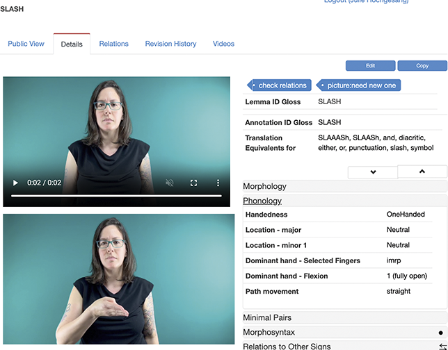 Screenshot of part of entry text for SLASH with phonology subsection expanded. Julie (white woman with brown hair) in a black top, signing. See long description.