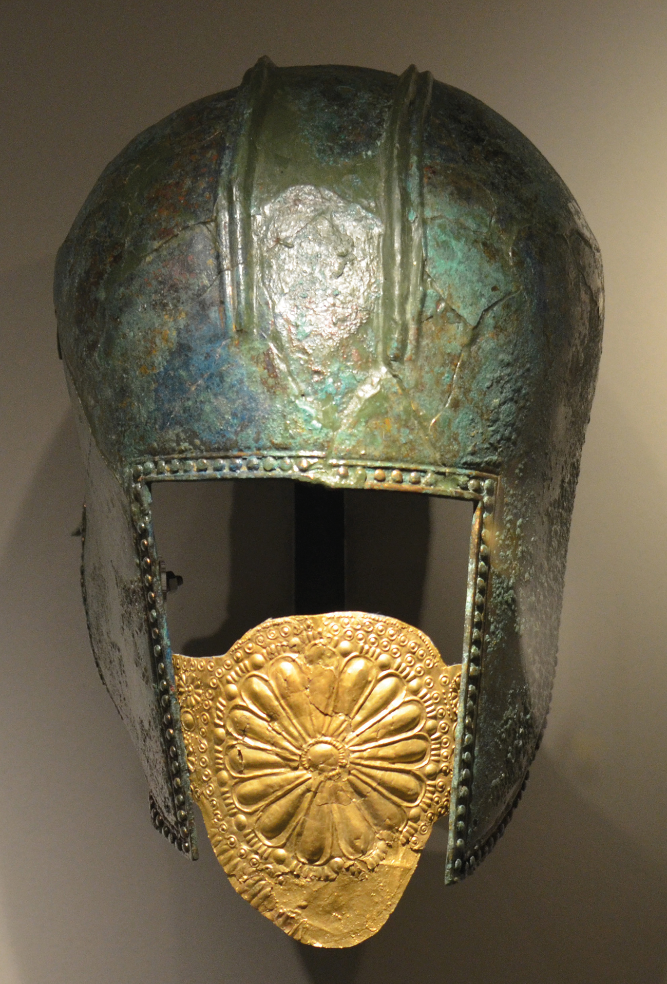 A bronze helmet with a gold mouthpiece from a warrior burial at Archontiko.