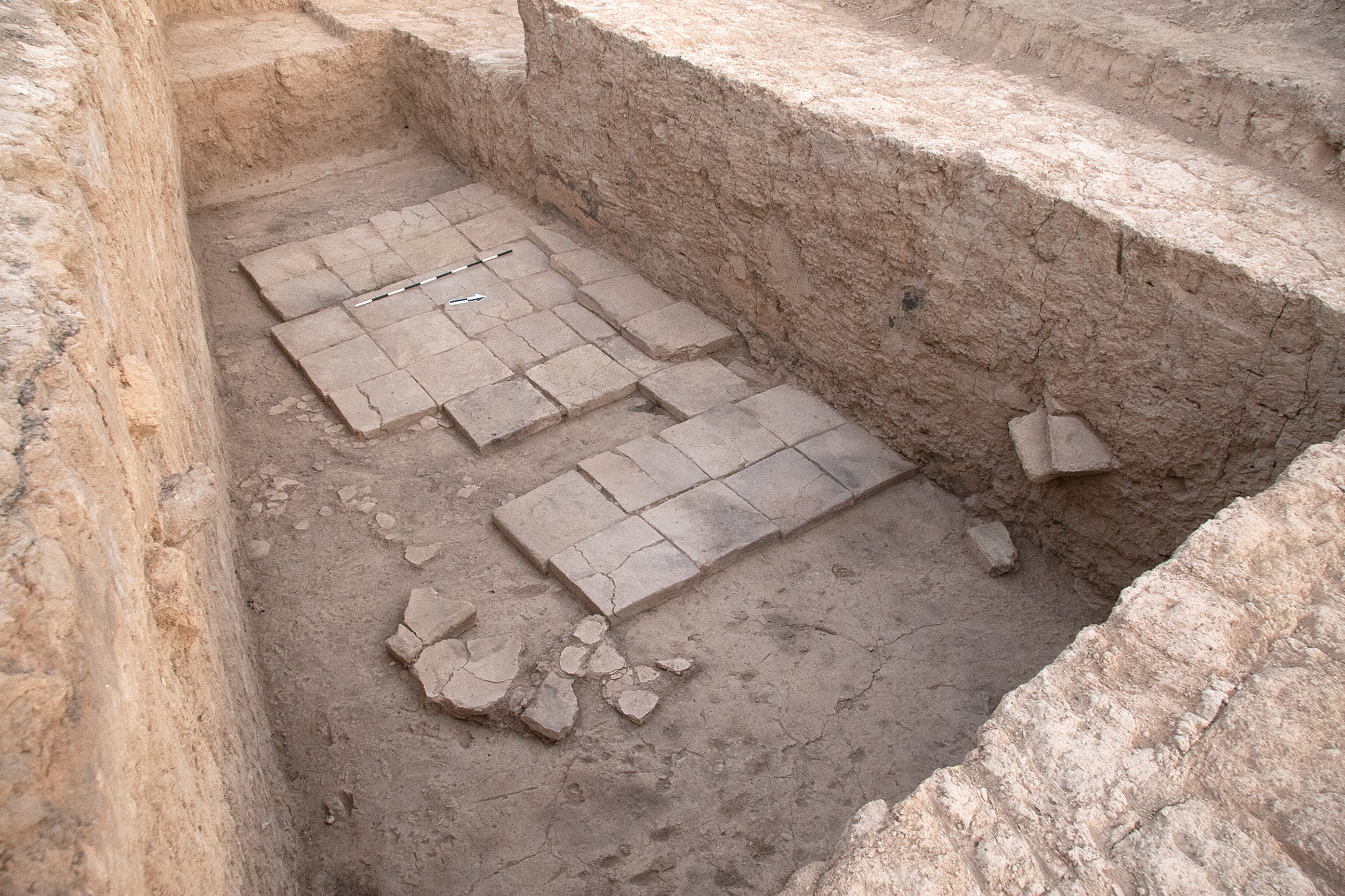 An archaeological excavation revealing ancient stone flooring.