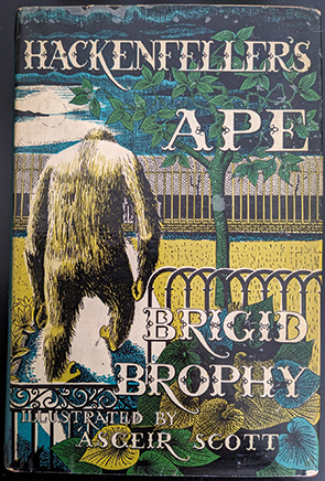 A book cover showing an ape in an enclosure surrounded by vegetation.