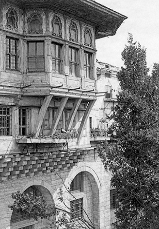 An exterior photograph of Mihrişah Valide Sultan’s Treasury Room, showing the projecting upper story, windows, supports, and carved façade details.