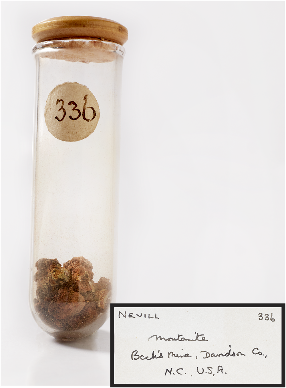 A glass vial containing montanite from Beck's Mine, labelled '336'.