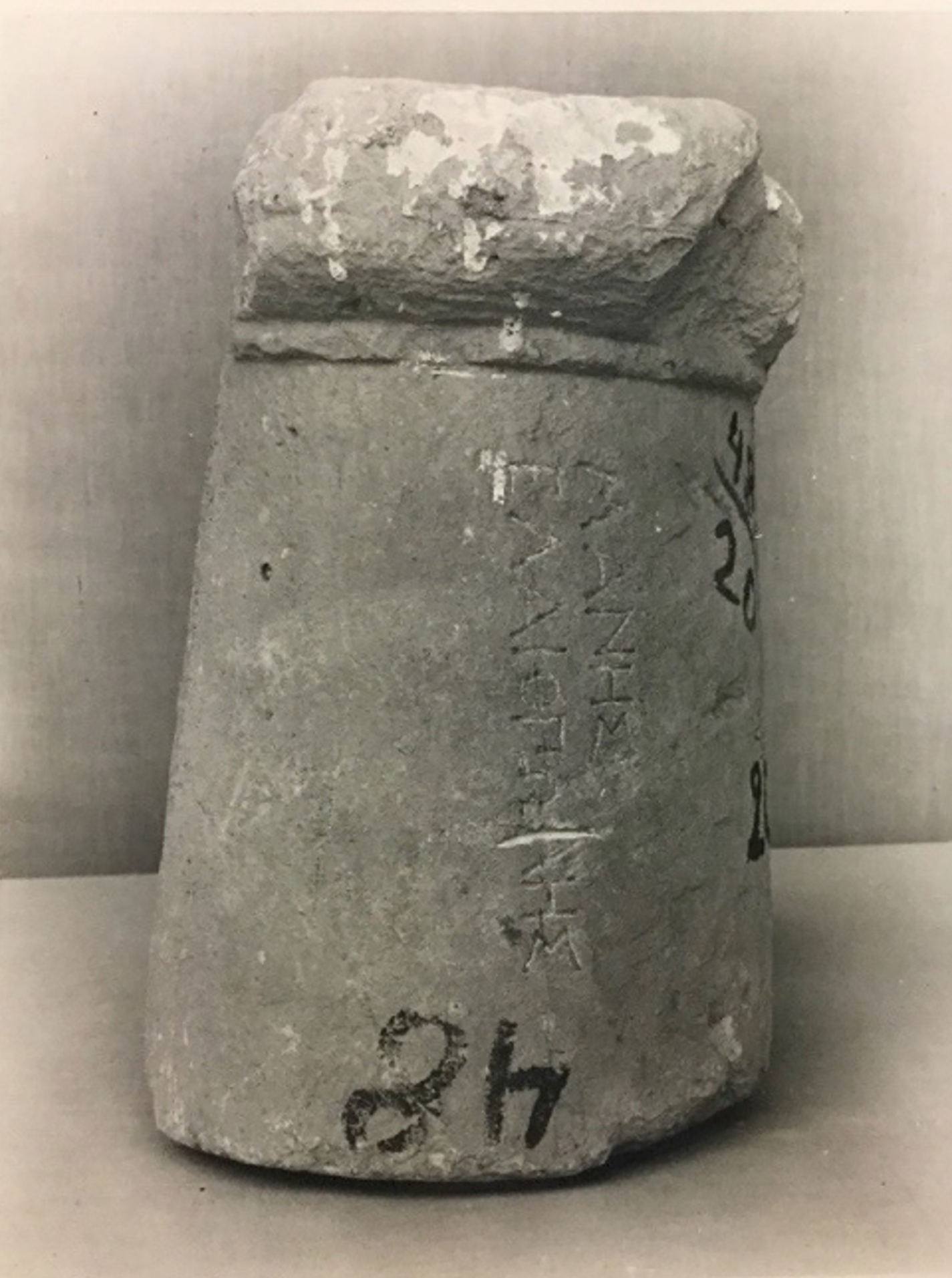 A stone tomb marker with inscriptions.