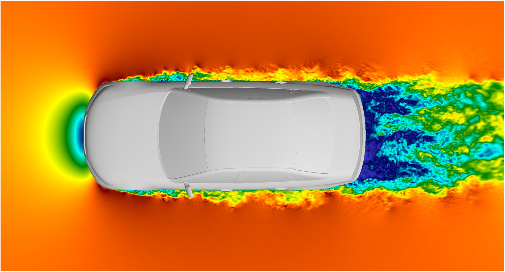 A top-down computational fluid dynamics visualization showing velocity magnitude contours around a white car. See long description.