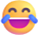A digital illustration of a yellow face with closed, smiling eyes, a wide open mouth showing teeth and a purple tongue, and two blue tears of joy streaming from the outer corners of the eyes.