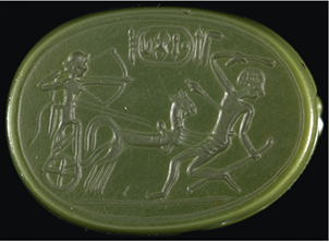 Photograph of a scarab base carved with a scene of Thutmose 1 riding a horse-drawn chariot while aiming his bow and arrow at a falling northeasterner. The cartouche of the king is at the centre top.