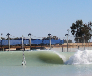 Cross shore wind induced changes to field scale overturning wave